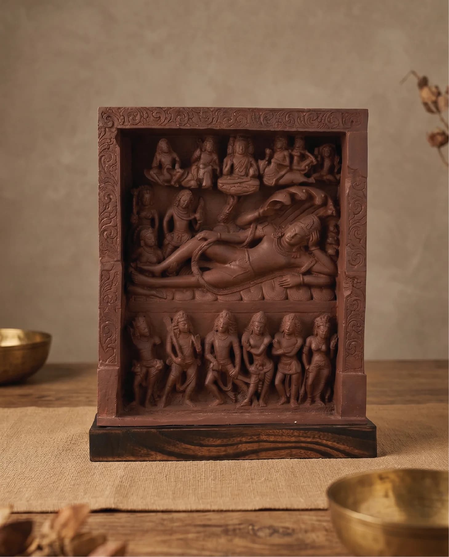 A front-facing view of the Anantasayana Vishnu Sculpture, a detailed terracotta-style museum replica featuring intricate mythological figures in relief.