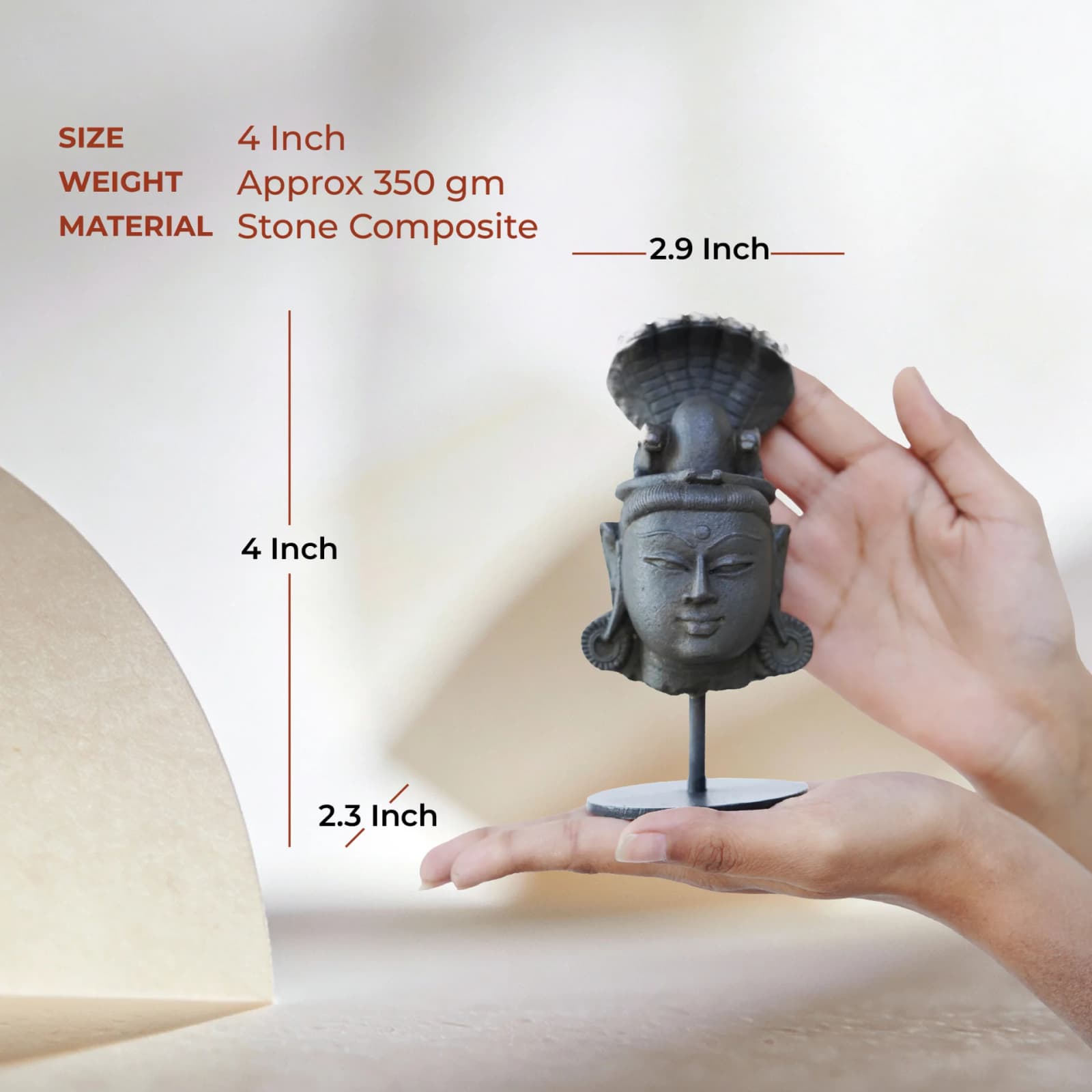 A person holding the Shiva Lingam with Nandi & Serpent stone composite replica to demonstrate its compact size.
