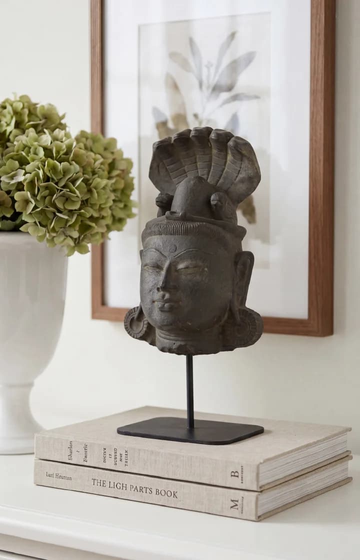 A detailed front view of the Shiva Lingam with Nandi & Serpent replica, featuring a weathered stone-finish texture on a stand.