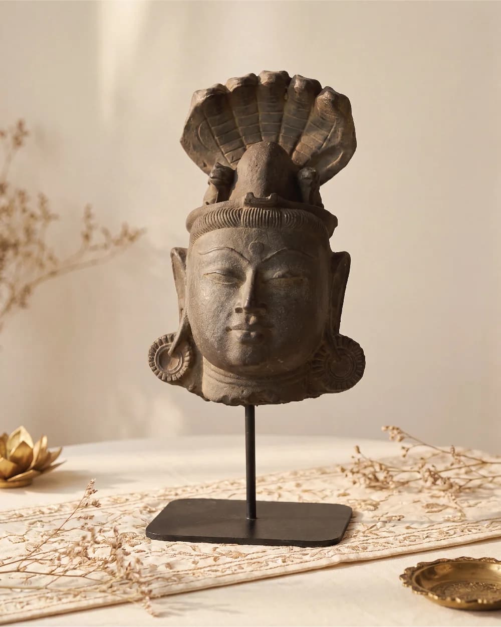 A front-facing view of the Shiva Lingam with Nandi & Serpent replica, featuring a dark, weathered stone-finish deity head.