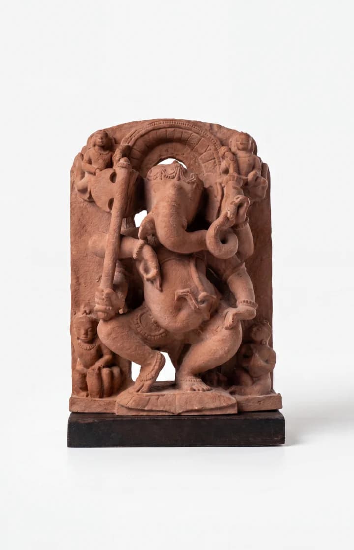 A front-facing view of the Ganesha Sculpture, a stone composite replica showing the deity dancing with small attendants.