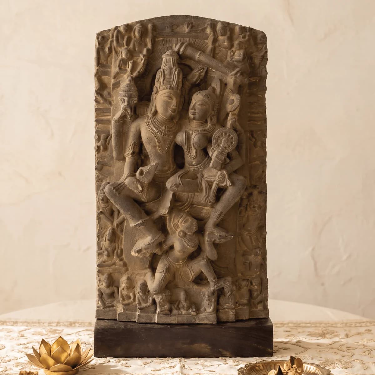 A front view of the Lakshmi Narayan Sculpture, a stone composite replica featuring intricate medieval carvings of deities.