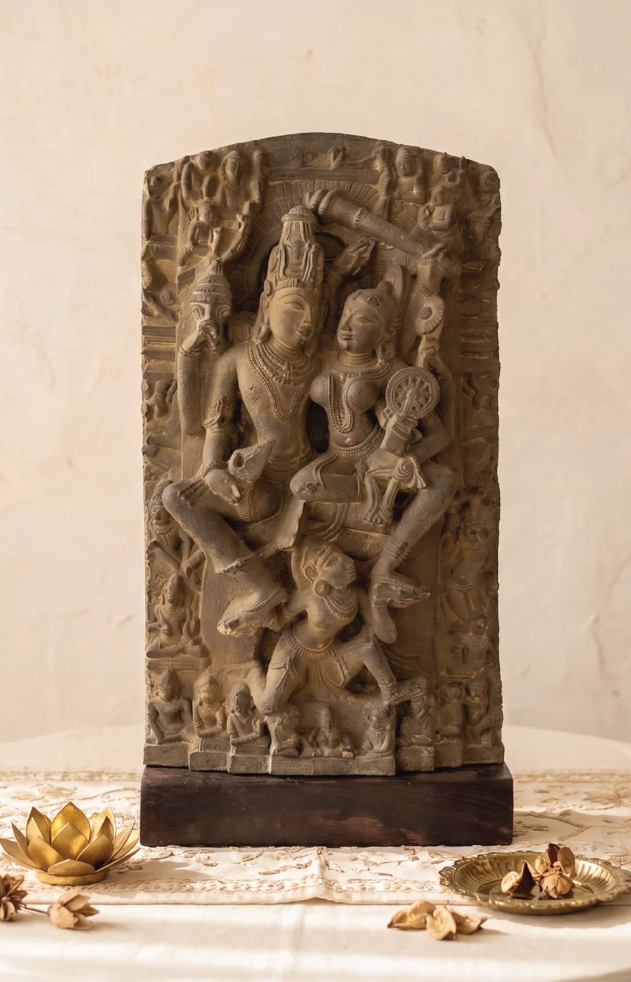 A front view of the Lakshmi Narayan Sculpture, a stone composite replica featuring intricate medieval carvings of deities.