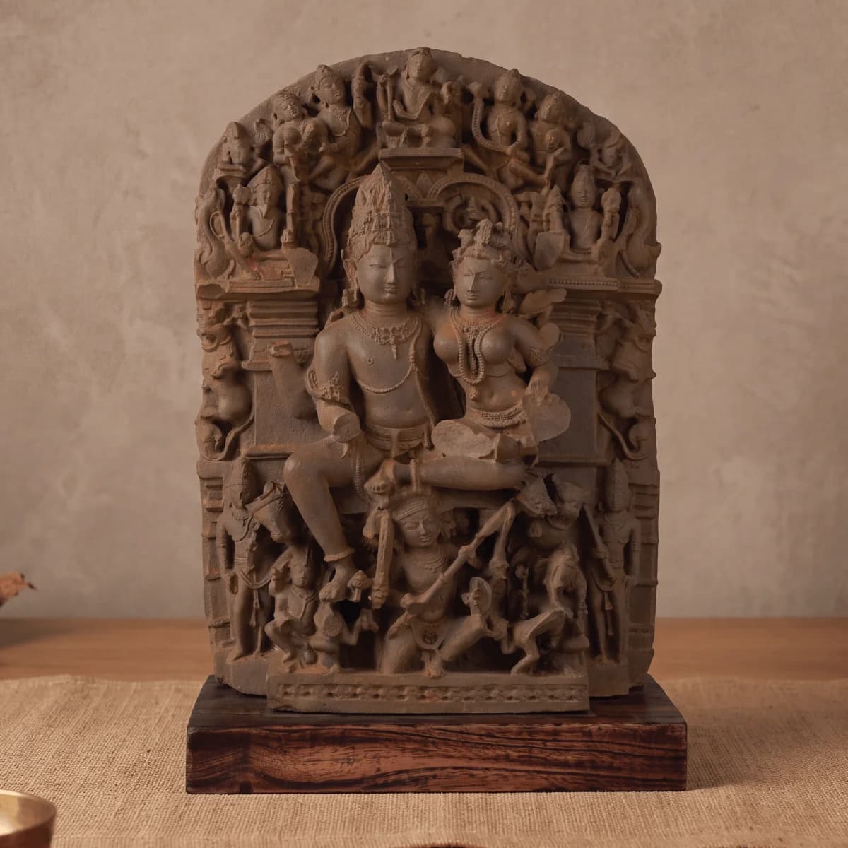 A front-facing view of the Ravananugraha Sculpture, a hand-finished stone composite museum replica featuring intricate carvings of Shiva and Parvati.